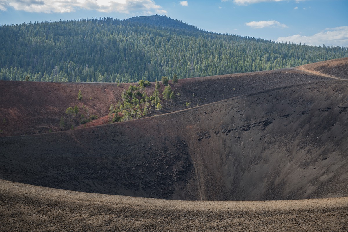 Cinder Cone summit interior view and surrounding forest